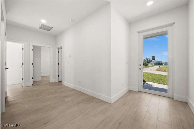 foyer entrance with light hardwood / wood-style floors