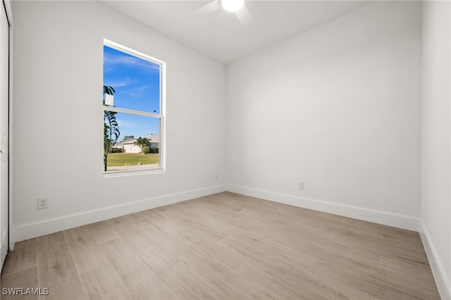 unfurnished room with ceiling fan and light hardwood / wood-style flooring