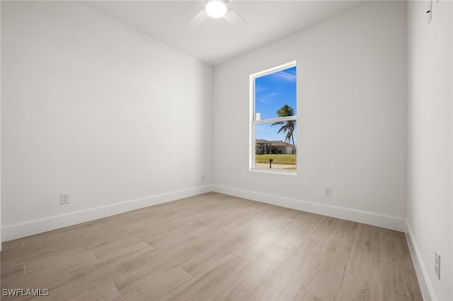 empty room with light hardwood / wood-style floors and ceiling fan