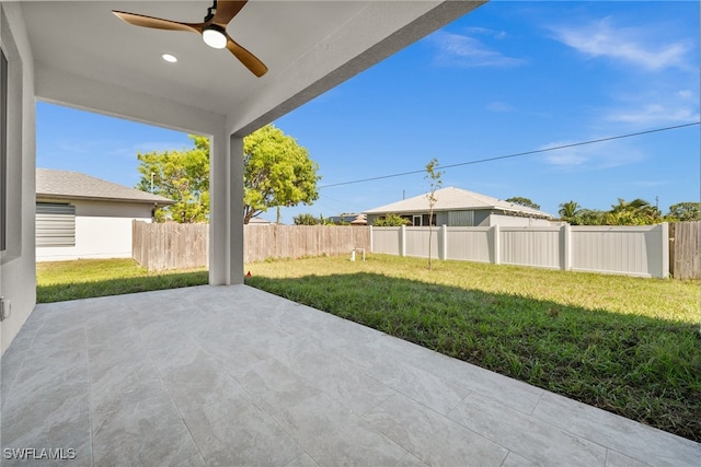 view of patio featuring ceiling fan