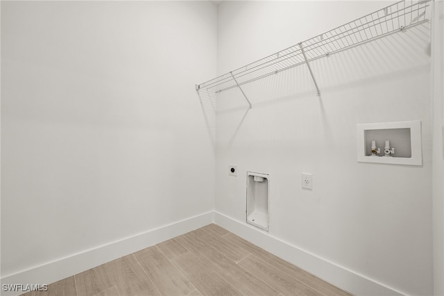 laundry room with hookup for an electric dryer, hookup for a washing machine, and hardwood / wood-style flooring