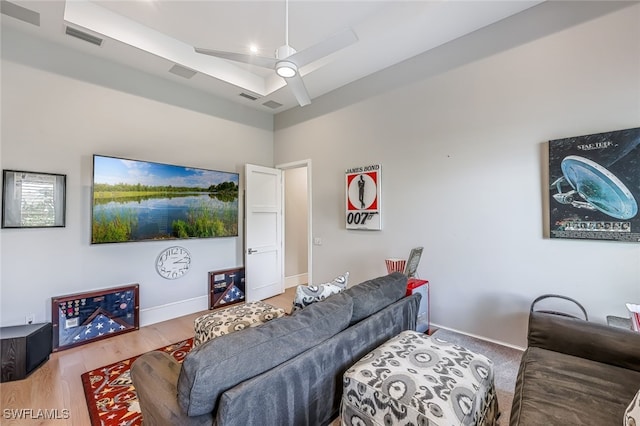 living room with ceiling fan and wood-type flooring