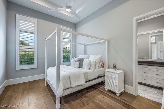 bedroom featuring hardwood / wood-style flooring and ceiling fan