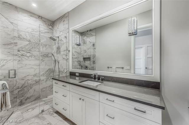 bathroom with vanity and an enclosed shower