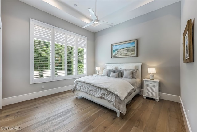 bedroom featuring ceiling fan and hardwood / wood-style floors