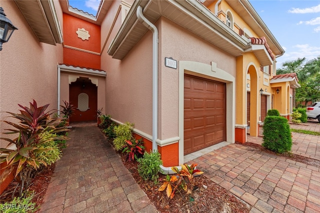 entrance to property featuring a garage