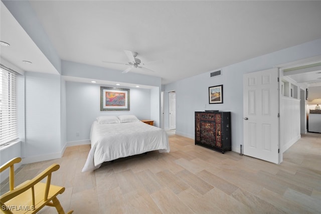 bedroom featuring multiple windows and ceiling fan