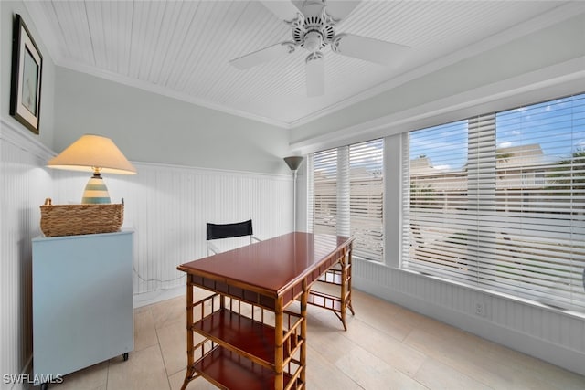 dining room featuring crown molding and ceiling fan