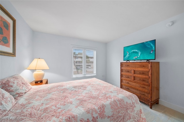 bedroom featuring light carpet