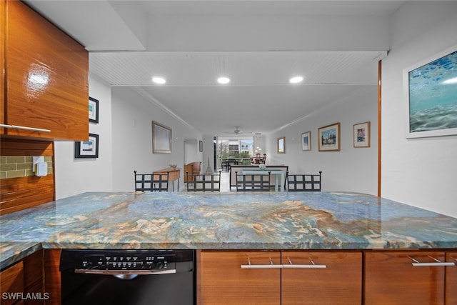 kitchen featuring dishwasher, ornamental molding, ceiling fan, and dark stone counters