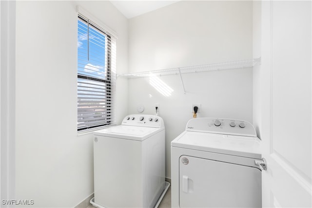 laundry area with washing machine and dryer