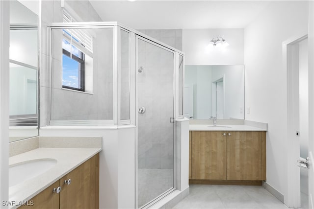 bathroom featuring vanity and walk in shower