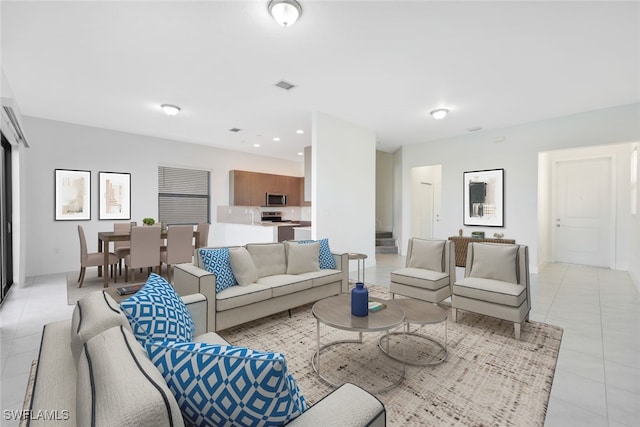 living room with light tile patterned floors