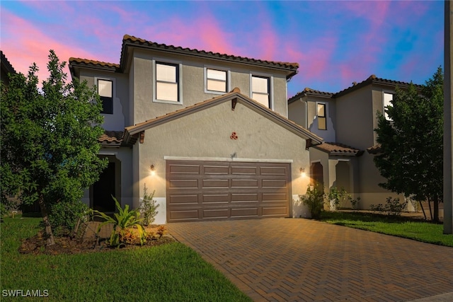 mediterranean / spanish-style house featuring a garage