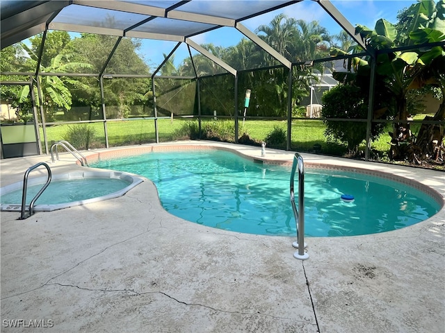 view of swimming pool featuring glass enclosure and a patio area