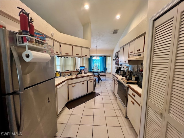 kitchen featuring white cabinetry, sink, hanging light fixtures, white appliances, and light tile patterned flooring