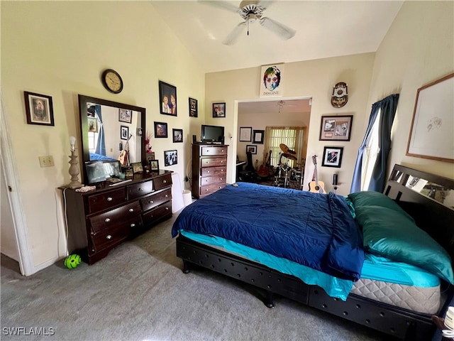 bedroom with carpet floors, vaulted ceiling, and ceiling fan