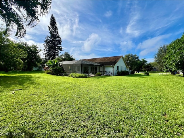 view of yard with a lanai