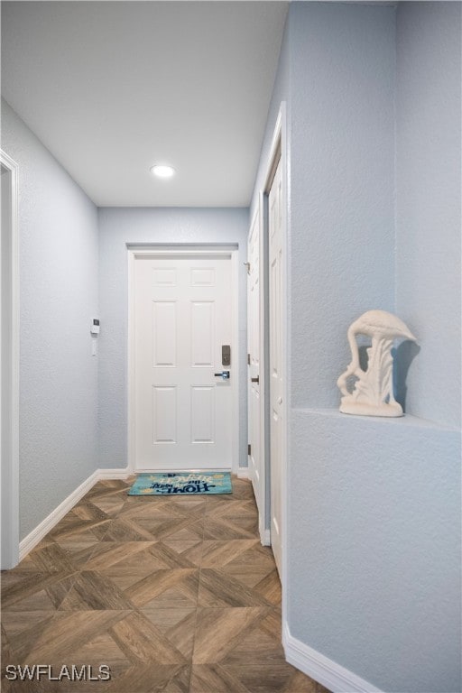 interior space with dark parquet flooring