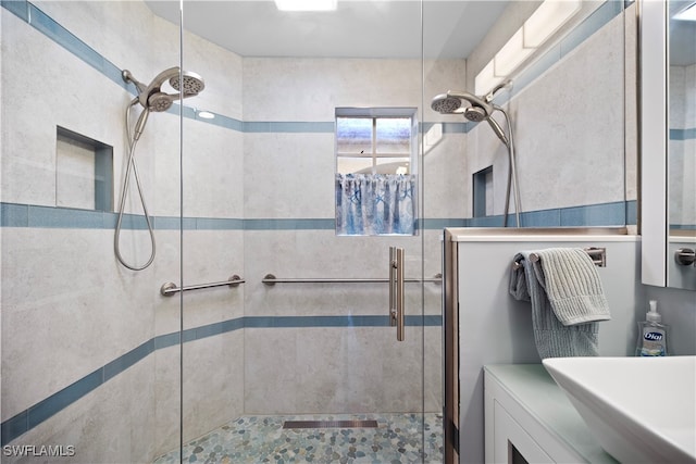 bathroom with a shower with door