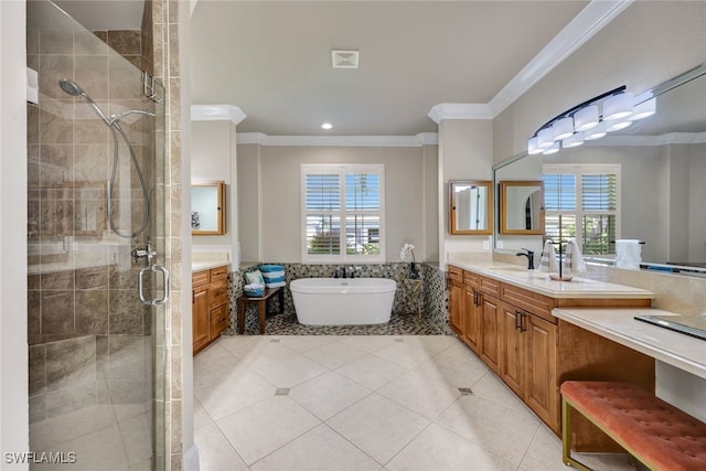 full bathroom with vanity, a stall shower, a freestanding bath, ornamental molding, and tile patterned floors