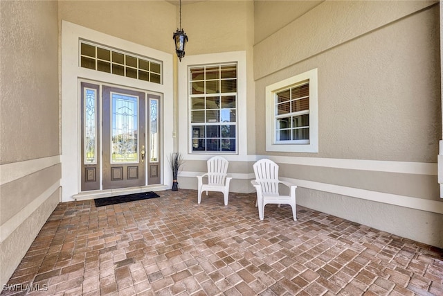 doorway to property featuring a porch