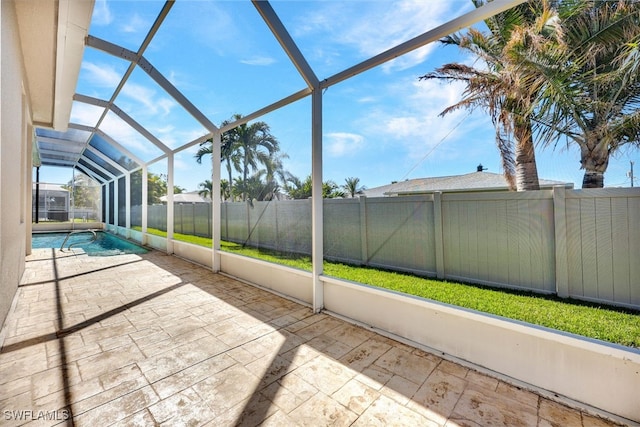 unfurnished sunroom featuring lofted ceiling and a pool