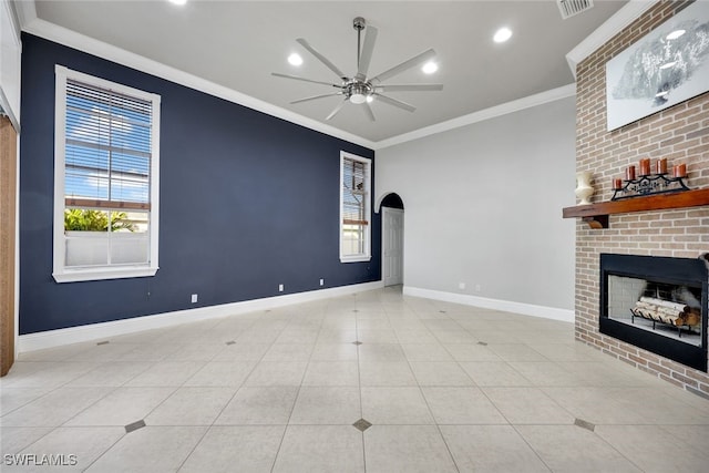 unfurnished living room featuring ceiling fan, a fireplace, light tile patterned floors, and ornamental molding