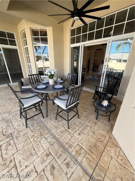 view of patio / terrace featuring ceiling fan