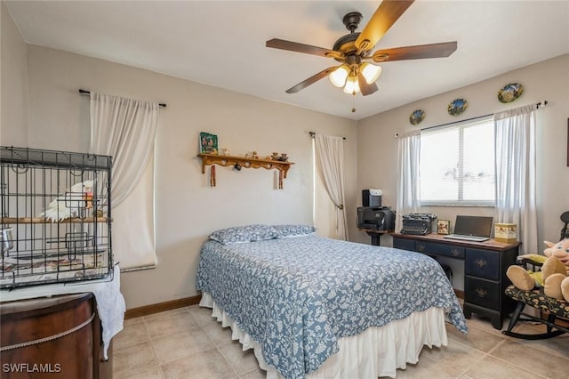 tiled bedroom featuring ceiling fan