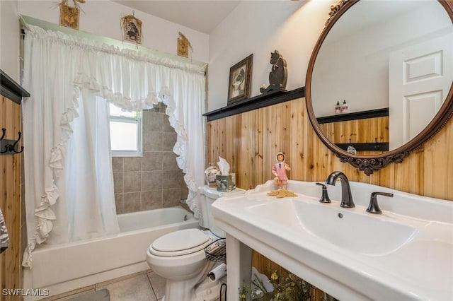 full bathroom featuring tile patterned floors, toilet, sink, and shower / bath combo