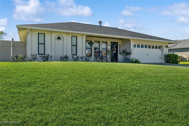 single story home with a front yard and a garage