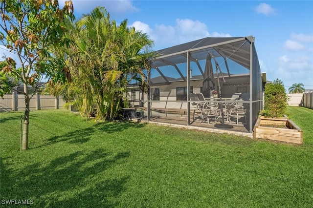 view of yard featuring a patio and a lanai