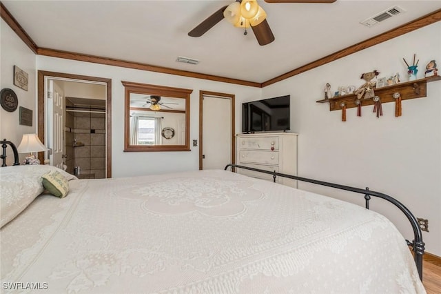 bedroom with crown molding, ceiling fan, and hardwood / wood-style floors