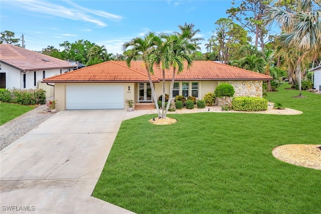 view of front of home featuring a garage and a front lawn