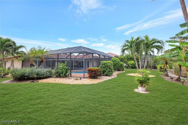 view of yard featuring glass enclosure