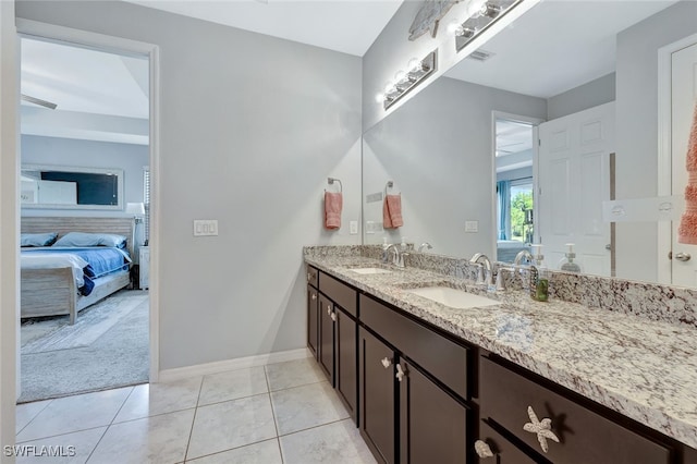 bathroom with tile patterned floors and vanity