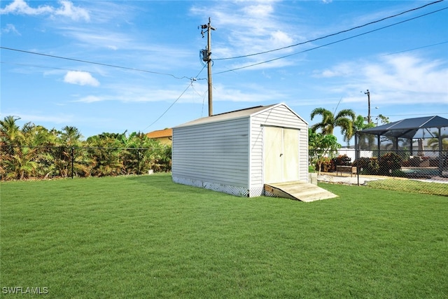 view of outdoor structure featuring a lawn