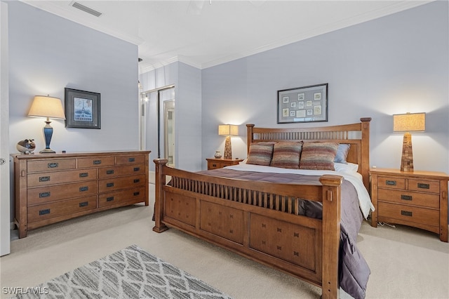 bedroom with crown molding and light colored carpet