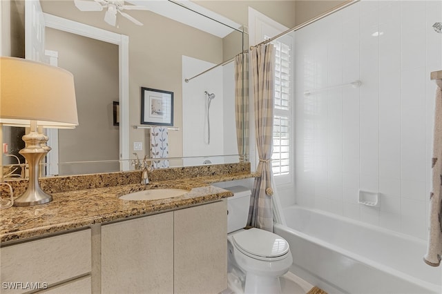 full bathroom featuring shower / bath combination with curtain, ceiling fan, toilet, and vanity