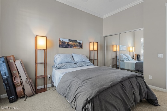 bedroom featuring a closet, light colored carpet, and ornamental molding