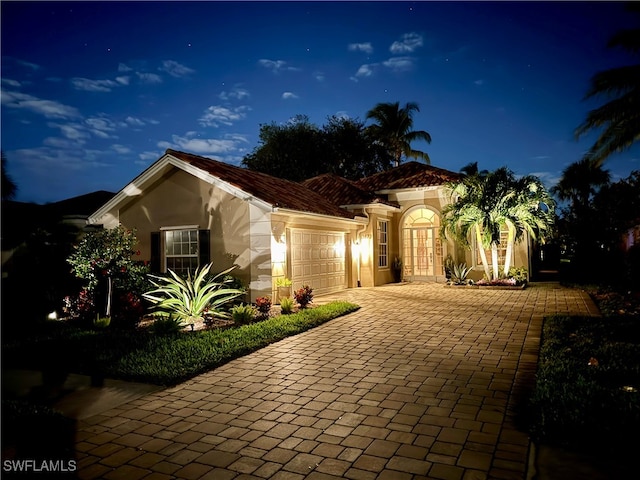 view of front of home with a garage