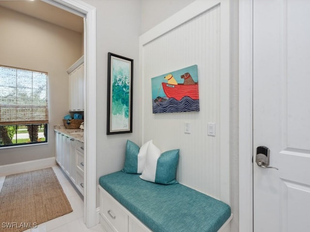 mudroom with light tile patterned flooring