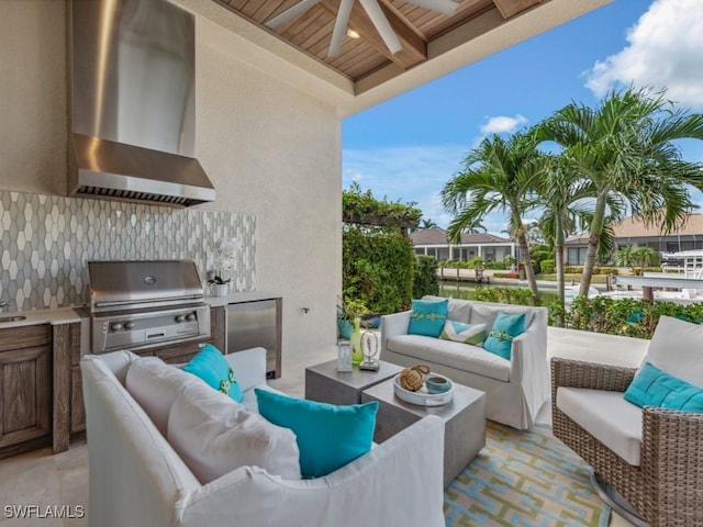 view of patio / terrace with an outdoor hangout area, ceiling fan, an outdoor kitchen, and a grill