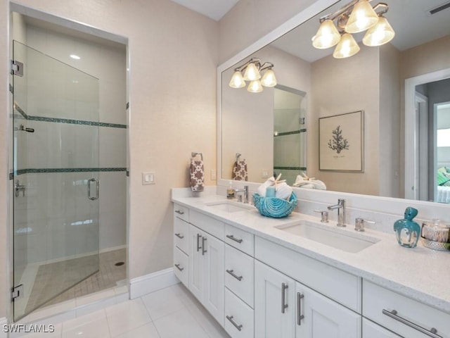 bathroom with vanity, tile patterned floors, and walk in shower