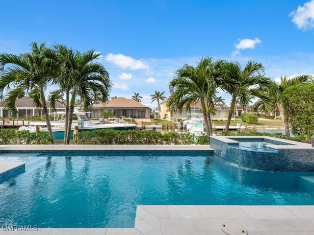 view of pool featuring an in ground hot tub