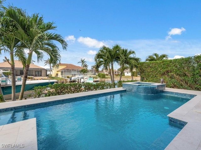 view of swimming pool featuring an in ground hot tub