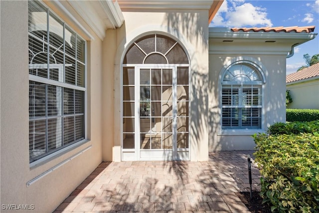 doorway to property with a patio