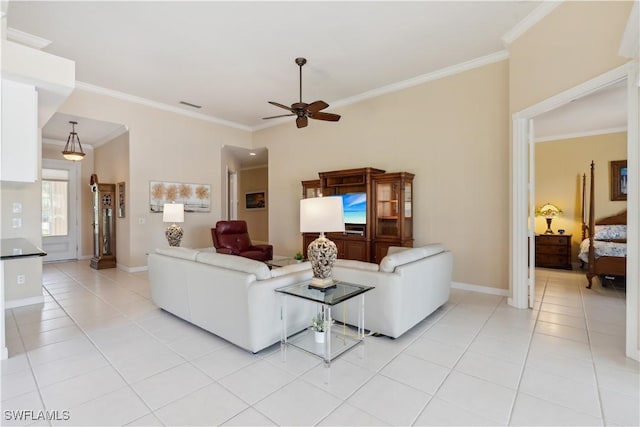 tiled living room featuring crown molding and ceiling fan