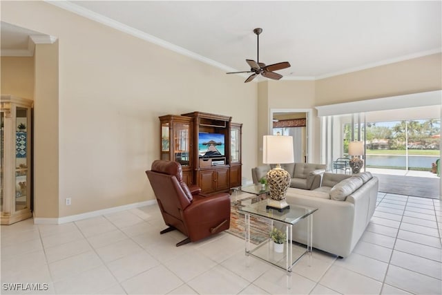 tiled living room with crown molding, ceiling fan, and a high ceiling